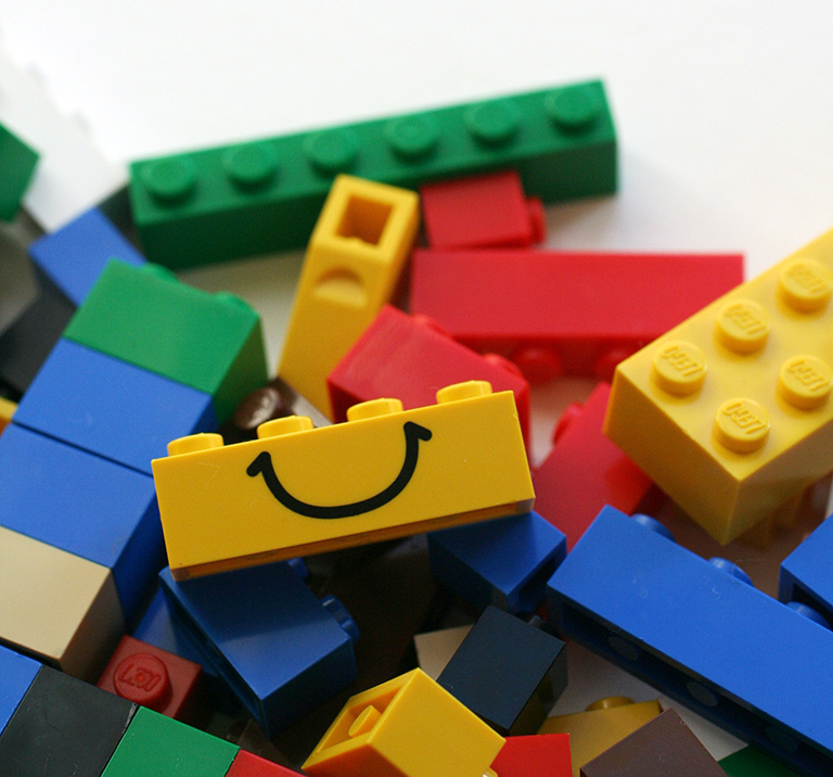 LEGO blocks with a smiling block